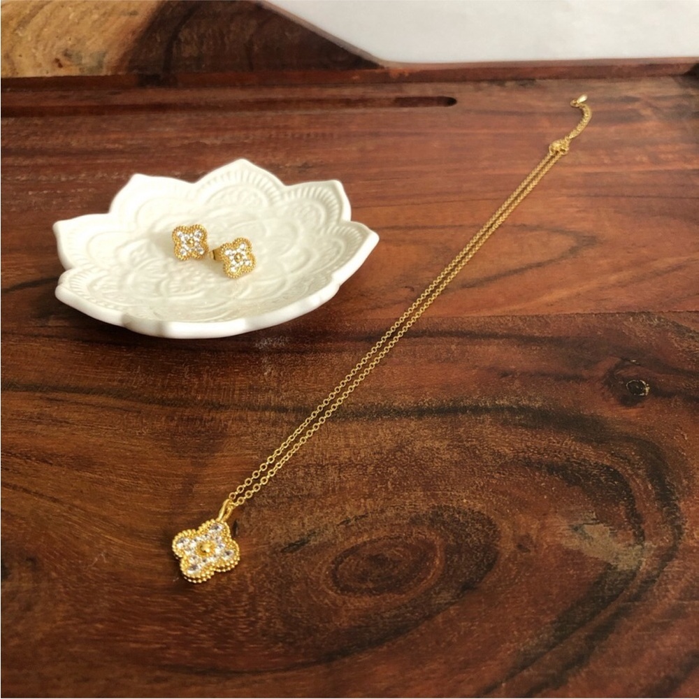gold-plated four-leaf clover jewelry set featuring a necklace matching earrings
